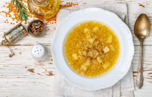Thick hot lentil soup with potatoes and spices img